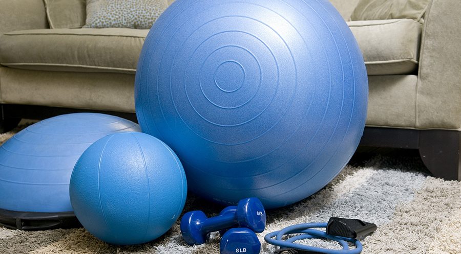 Set of blue exercise balls and weights.