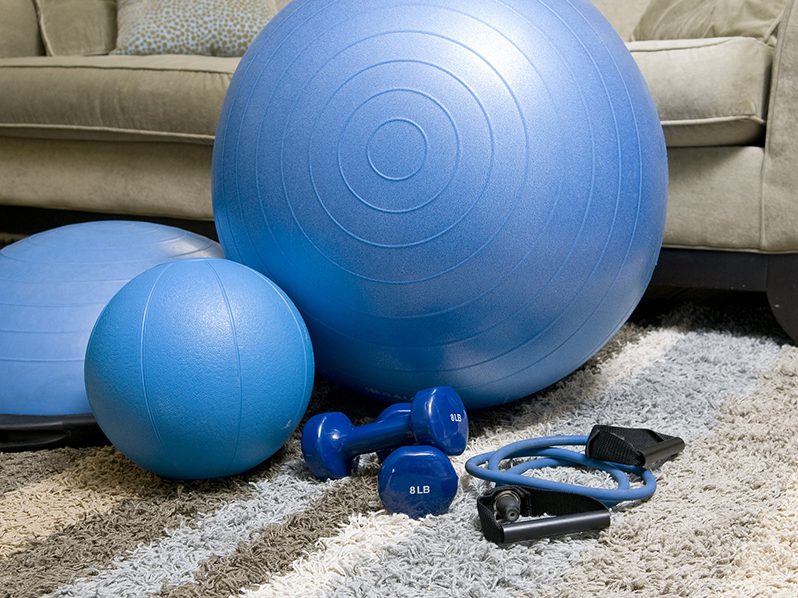 Set of blue exercise balls and weights.
