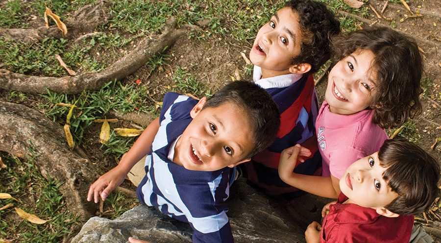 Group of children looking up.