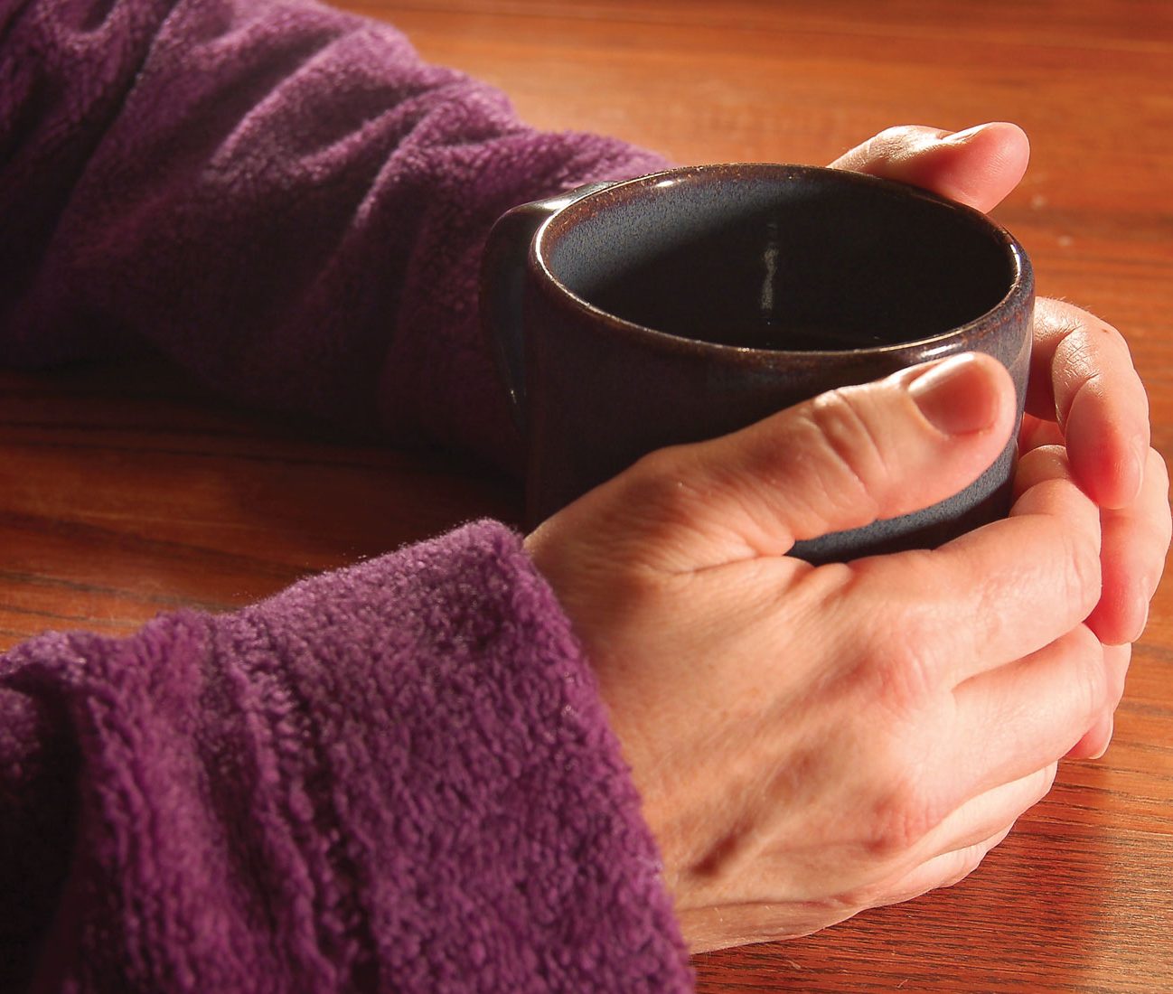 Woman holding a hot beverage