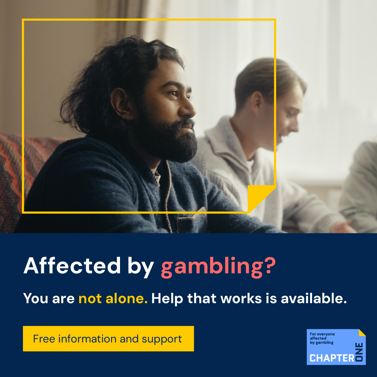 side image of a man of south Asian heritage with chin length black hair and full black beard