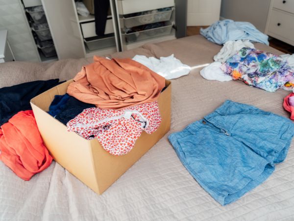 Clothes being sorted out into boxes