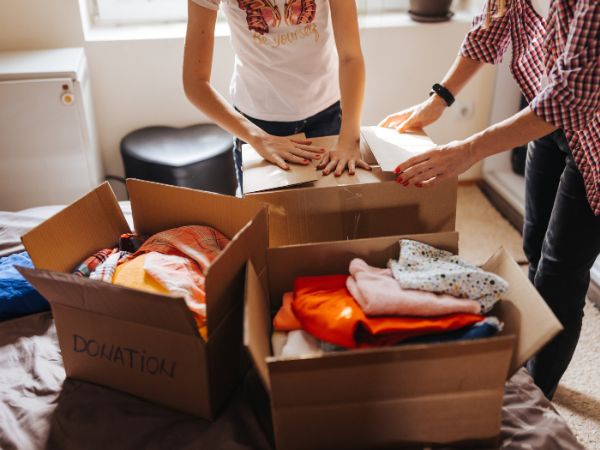 Clothes being sorted out into boxes