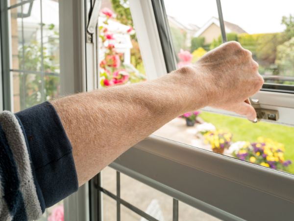 Arm opening a window