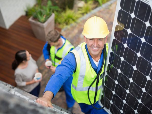 Engineer installing solar panels
